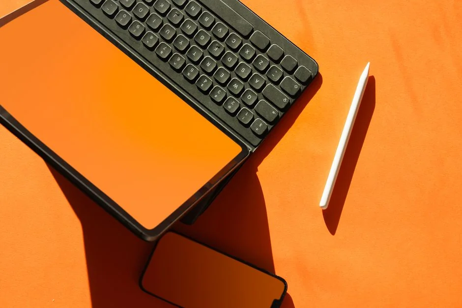 Stylish and efficient workspace with multiple monitors, laptop, and smartphone, showcasing a web design project.
